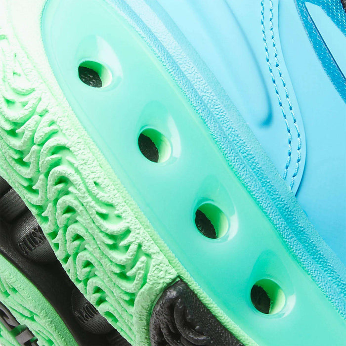 Close-up of Reebok Engine A Basketball Shoes: mint green SuperFloat foam midsole with ventilation holes, textured light green and black outsole, and a blue upper—ideal for top performance on the basketball court.