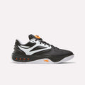 The Reebok Engine A Pump Shoes are black and white athletic sneakers with orange accents, featuring a white sole and multiple ventilation holes along the midsole. Designed for ultimate comfort and agility on the court, these performance basketball shoes incorporate advanced Pump technology for a customizable fit during dynamic play. Shown here on a plain white background.