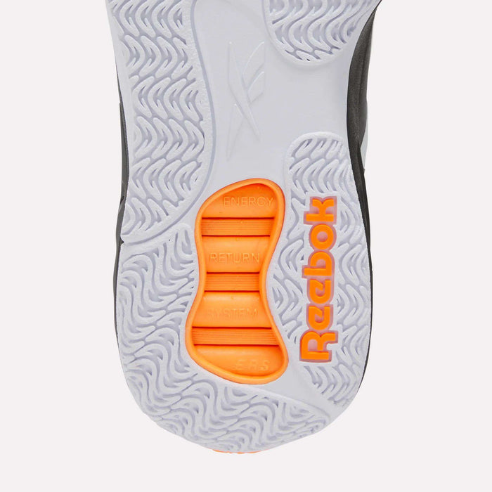 Close-up of the sole of the Reebok Engine A Pump Shoes, showcasing the orange Reebok logo, textured gray grip patterns inspired by performance basketball shoes, and “Energy Return System” displayed on an orange section at the center.
