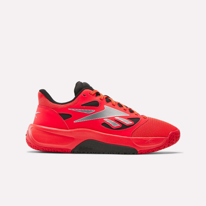 The Reebok Engine LT Shoes feature a bright red mesh upper with black and white accents, a black tongue and laces, a thick textured sole, and a large stylized Reebok logo on the side for standout basketball style.