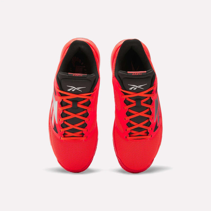 Top view of a pair of Reebok Engine LT Shoes in bright red with black interiors, black and red tongues, and black side detailing, displayed on a plain white background.