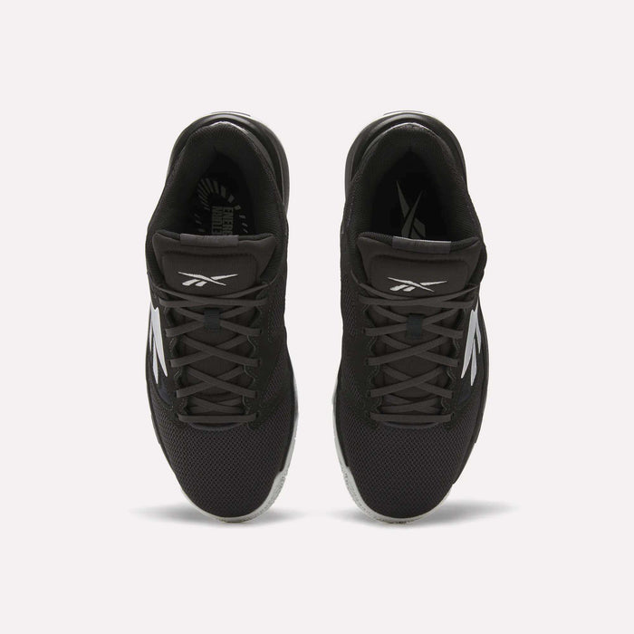Top view of a pair of Reebok Engine LT Shoes in black with white logos and accents, featuring mesh uppers and black laces, placed side by side on a white background.