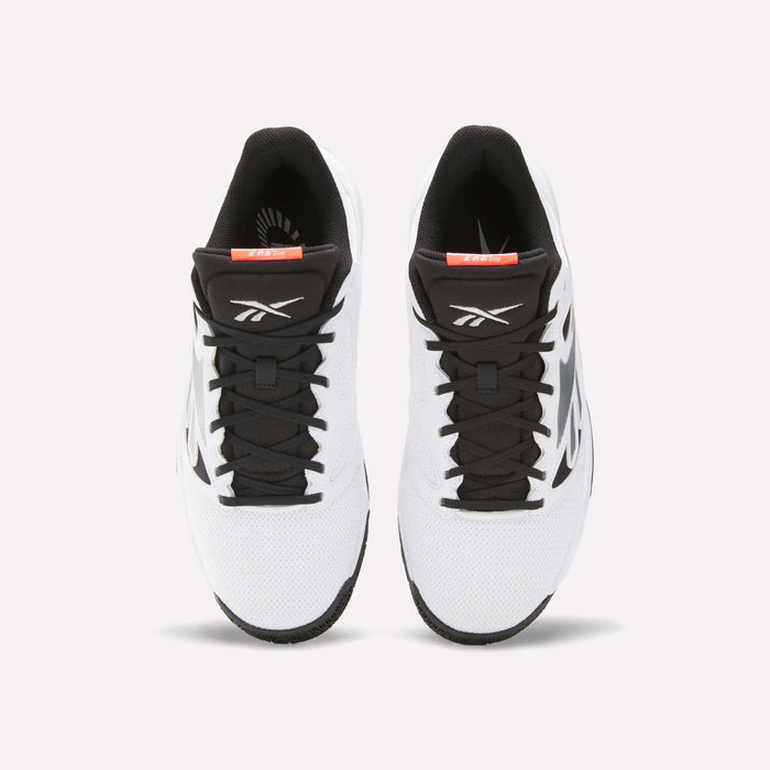 A pair of Reebok Engine LT Shoes in white with black laces, tongue, and detailing is shown from above on a light background. The Reebok logo appears on each shoe's tongue.