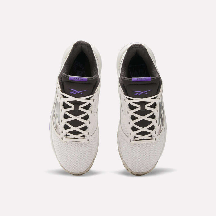 Top view of a pair of Reebok Engine LT Shoes in white with black and purple accents, white laces, and visible Reebok logos on the tongue and side. These cushioned sneakers are shown side by side on a plain white background.