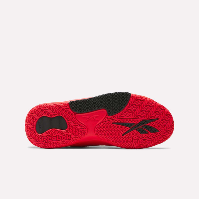 The image displays the red and black sole of Reebok Engine LT Shoes, featuring a wavy traction pattern, textured grip zones for better performance, and the iconic Reebok logo—perfect for anyone seeking high-quality basketball footwear.