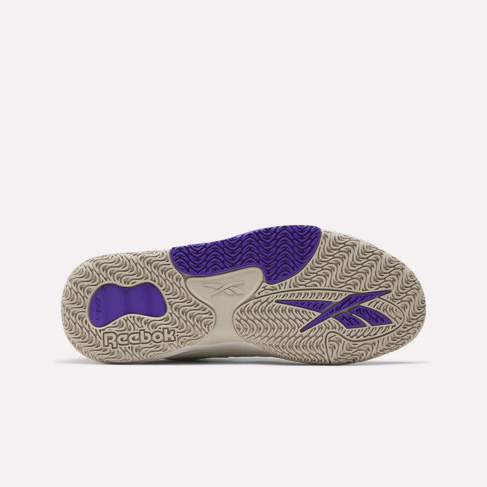 The image shows the sole of Reebok Engine LT Shoes, mainly beige with detailed wavy tread patterns and purple accents, including the Reebok logo and signature on the side and heel—ideal for fans of cushioned sneakers.