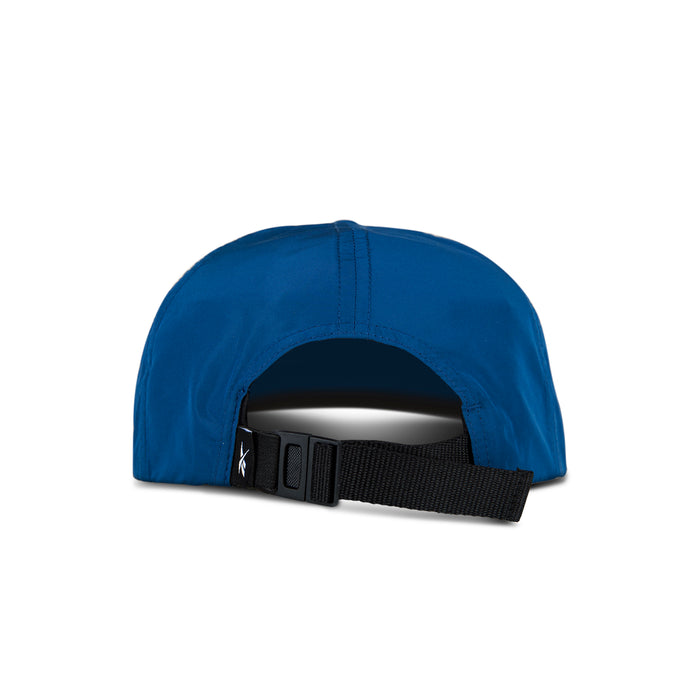 A blue Reebok Flat Brim Running Cap shown from the back, featuring a black adjustable strap with a plastic buckle for sizing. This lightweight cap is displayed against a white background.