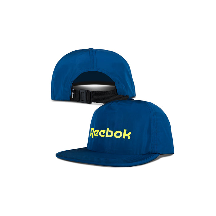Two views of the Reebok Flat Brim Running Cap: the front features a yellow Reebok logo, while the back reveals an adjustable black strap and curved opening. This lightweight cap is displayed on a white background.