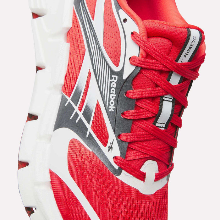 A close-up of the Reebok FloatZig 2 Running Shoes in red, featuring white and black accents, a supportive mesh upper, white laces, and a thick textured white sole. The FloatZig label appears near the tongue.