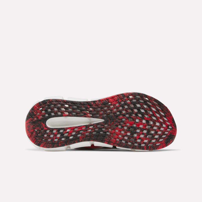The image shows the sole of the Reebok FloatZig 2 Running Shoes, featuring a black, red, and white checkered pattern with a translucent window in the center, all set against a plain white background.