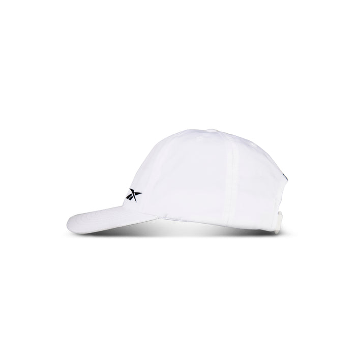 The Reebok Flow Cap, shown from the side on a plain white background, features a curved brim and small black logo on the front. Made from recycled polyester, it offers all-day comfort with a moisture-wicking sweatband.