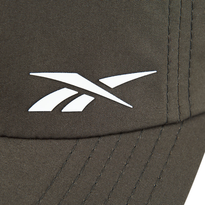 Close-up of the Reebok Flow Cap in brown, crafted from recycled polyester with a white Reebok logo, visible stitching, and a moisture-wicking sweatband for comfort.