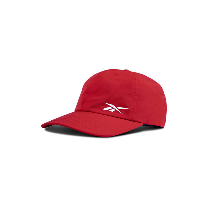 The Reebok Flow Cap is a red baseball cap with a curved brim and a white Reebok logo on the front, shown against a white background.