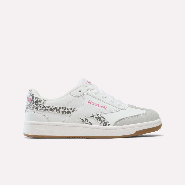 White Reebok Forte Pitch Shoes for Big Kids in White/True Pink, featuring a gray suede toe, pink logo detailing, and leopard print accents on the heel and side, are displayed on a plain white background—these sneakers offer a bold yet classic style perfect for any collection.