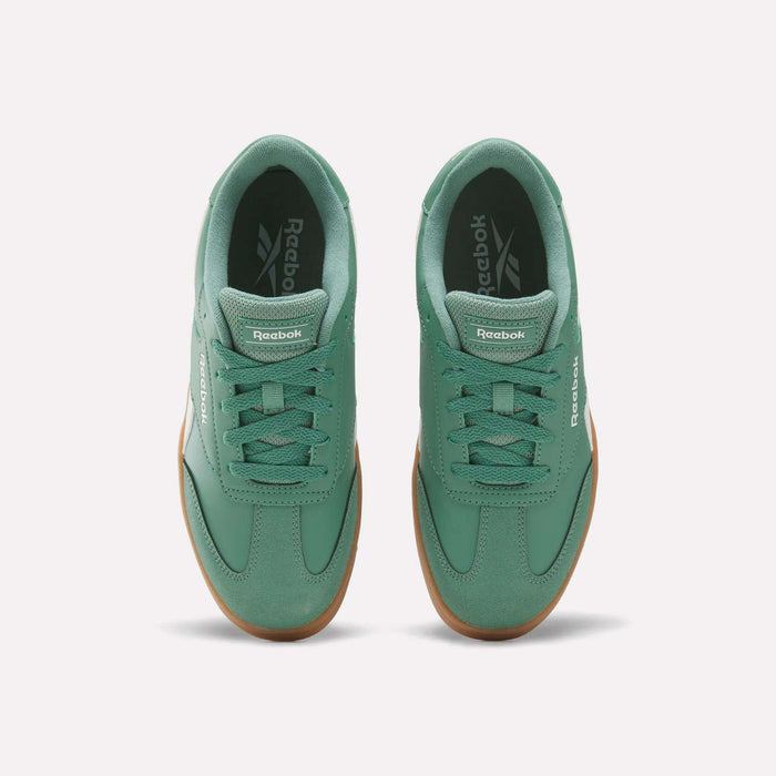 A pair of Reebok Forte Pitch Shoes - Big Kids sneakers in green with gum soles, shown from above on a white background.