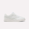 The Reebok Forte Pitch Shoes for little kids are shown in white, featuring a low-top, court-inspired design with white laces and understated stitched details, set against a simple light background.