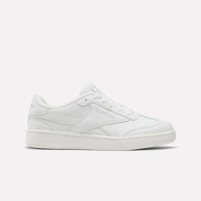The Reebok Forte Pitch Shoes for little kids are shown in white, featuring a low-top, court-inspired design with white laces and understated stitched details, set against a simple light background.