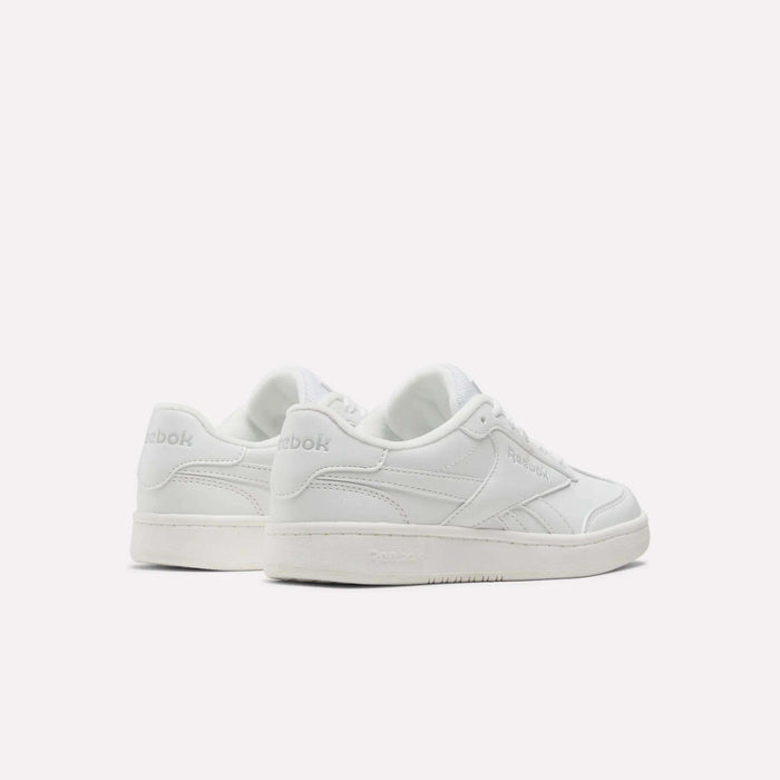 A pair of Reebok Forte Pitch Shoes - Little Kids in white are displayed on a plain light background, with one shoe facing forward and the other angled to reveal the side and back, showcasing their tennis-inspired design.