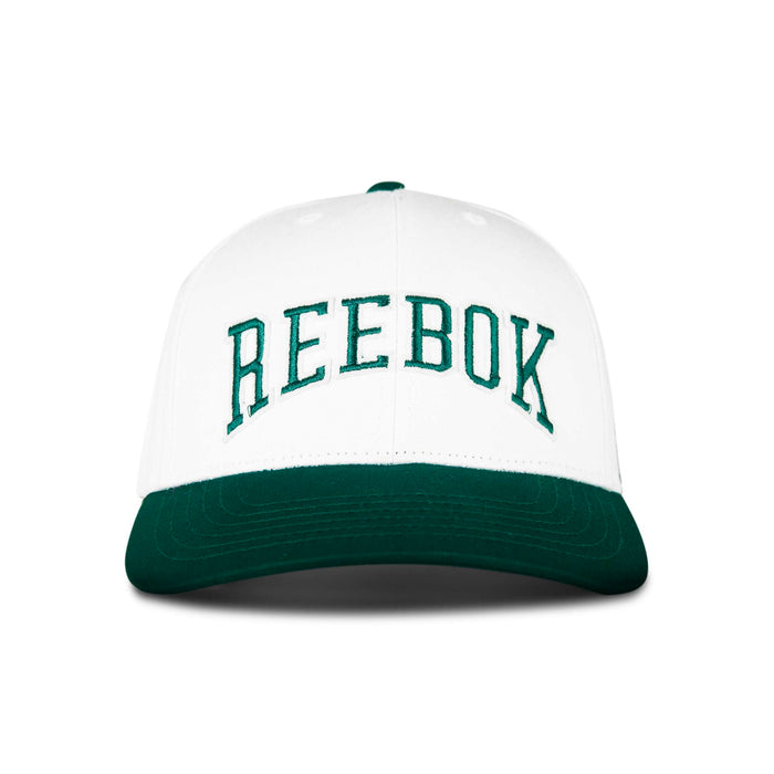 The Reebok Gameday Cap features a white crown, a dark green curved brim, and large green REEBOK embroidery on the front.