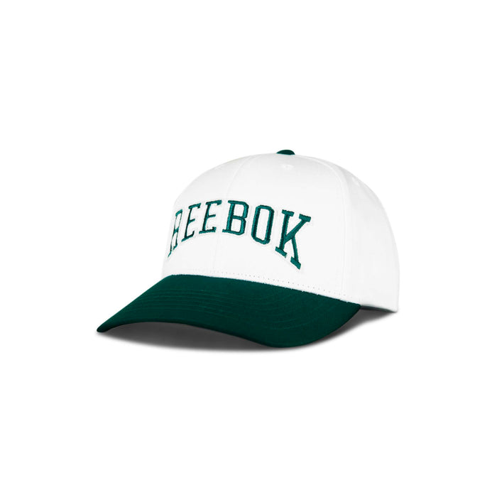 The Reebok Gameday Cap features a white crown, dark green brim, and "REEBOK" embroidered in green on the front. Displayed against a plain white background.