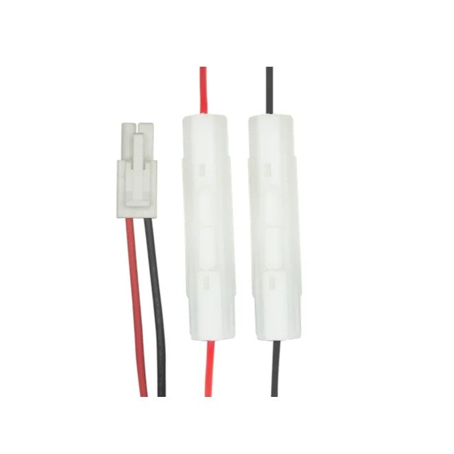 Two white cylindrical battery terminal connectors with red and black wires