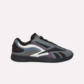 The Reebok Hammer Pro LTD Shoes feature layered faux leather panels in gray, black, and purple, a modern low-top design, black laces, and a chunky black sole—all set against a crisp white background.