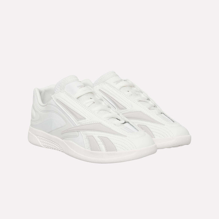A pair of Reebok Hammer Pro LTD Shoes in white faux leather, highlighted with subtle light gray accents and a durable rubber sole, showcases a sleek, modern design against a plain white background.