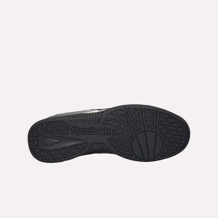 Bottom view of a black Reebok Hammer Pro LTD Shoe, displaying the textured, durable rubber sole with geometric patterns and the Reebok logo featured at the center. The shoe boasts a sleek faux leather upper for enhanced style and comfort.