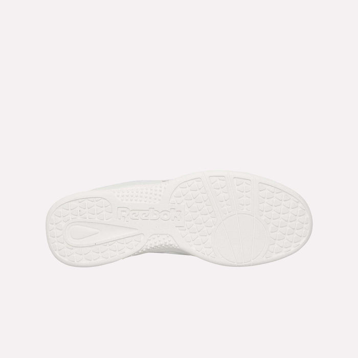 The image displays the durable rubber outsole of the Reebok Hammer Pro LTD Shoes, viewed from underneath. The outsole showcases assorted textured patterns, such as circles and triangular shapes, with the Reebok logo embossed at its center.