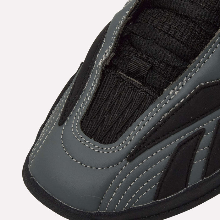 Close-up of the toe and upper section of a Reebok Hammer Pro LTD Shoes in gray and black, featuring white stitching that highlights the detailed texture and paneling on the faux leather upper, complemented by black laces and a durable rubber sole.