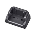A black plastic camera battery charger dock