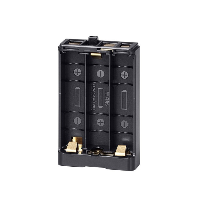 A black 3-cell battery charger with gold metal contacts