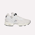 The Reebok Instapump Sliver Shoes are white and light gray sneakers with a chunky sole and unique cutout design, featuring Hexalite cushioning for comfort, displayed from the side on a light blue background.