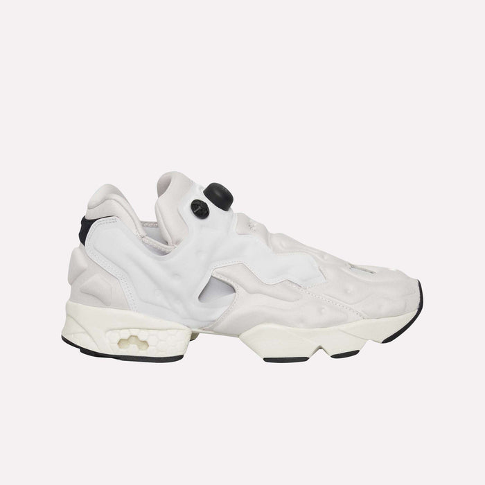 The Reebok Instapump Sliver LTD Shoes in white and light gray feature a chunky sole, textured accents, distinctive cutouts, and Reebok’s signature air pump system for a personalized fit, showcased against a plain white background.