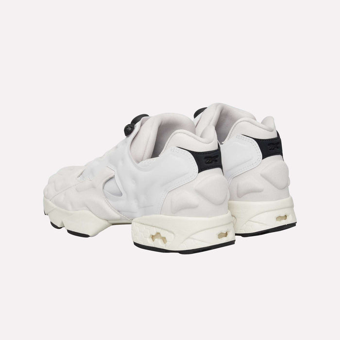 A pair of Instapump Sliver LTD Shoes by Reebok in white with chunky soles and black accents, showcasing signature InstaPump technology, displayed from the back and side against a plain light background.