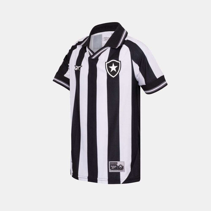 The Kids' Botafogo Youth Home Jersey by Reebok features black and white stripes, short sleeves, a collar, and the club shield logo on the chest—ideal as the 25/26 football shirt for young fans.