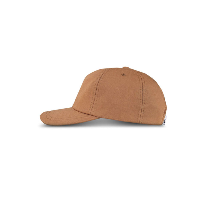 A side view of the Reebok Logo S-Reebok Vector Cap, a plain brown cap with visible stitching, displayed against a white background.