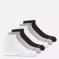 Six pairs of Reebok Kids' Low Cut Basic Socks—two white, two light gray, and two black—are arranged in a row on a plain white background. Moisture-wicking fabric keeps feet dry and comfortable.