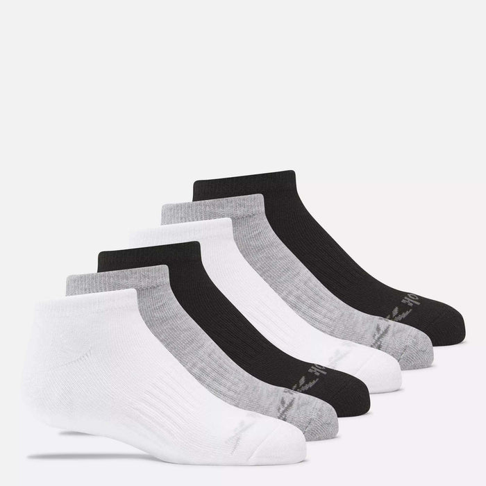 Six pairs of Reebok Kids' Low Cut Basic Socks—two white, two gray, and two black—are arranged in a row on a plain white background. These cushioned socks feature moisture-wicking fabric for comfort.