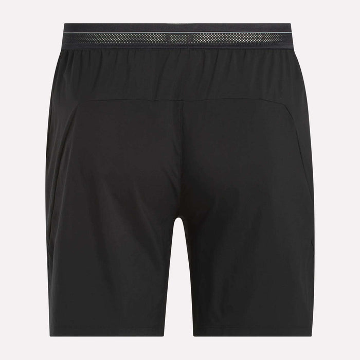 Reebok Men's Athlete Speed Shorts shown from the back, feature a simple, modern design with an elastic waistband and lightweight RBK-DRY fabric. The shorts have a subtle, shiny waistband pattern and no visible logos or embellishments.