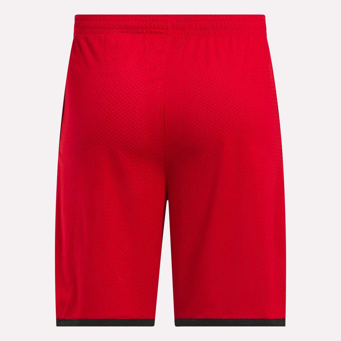Back view of Reebok Men's Basketball Mesh Shorts in bright red, featuring an elastic waistband, black hem trim, and RBK-DRY technology for breathable comfort, shown against a white background.