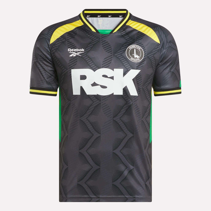 The Men's Charlton Third Jersey by Reebok features a black and gray pattern with yellow and green accents, large RSK text in white, Crawley Town FC and Reebok logos on the chest, and is made from lightweight fabric.