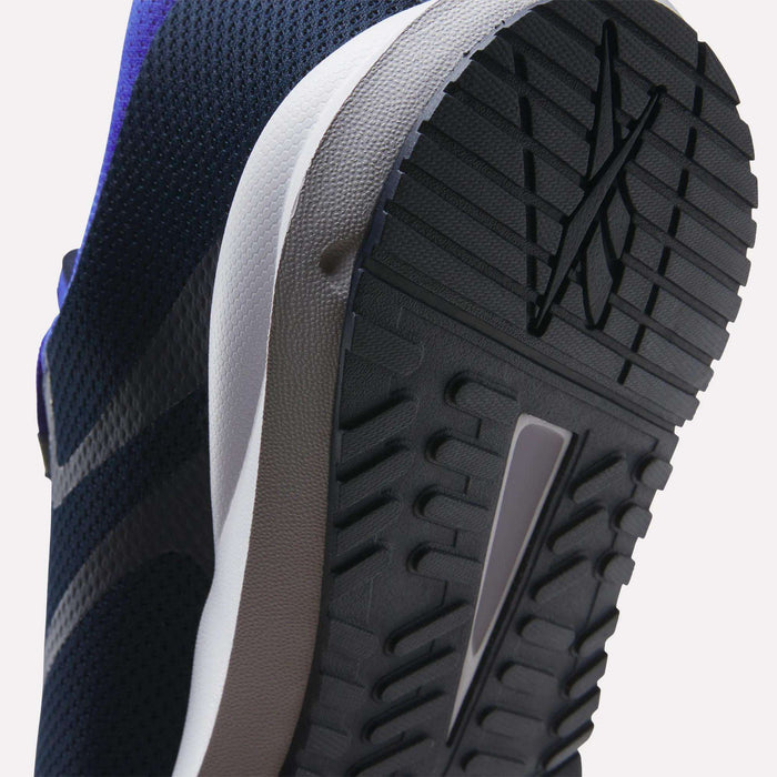 Close-up of the sole of Reebok Men's Cityride 2 Running Shoes, showing textured tread patterns and logo on the black rubber outsole, FuelFoam cushioning in the white midsole, and part of the purple upper.