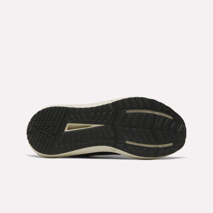 The image shows the black rubber outsole of Reebok Men's Cityride 2 Running Shoes with textured tread for grip and a light midsole with FuelFoam cushioning, as the shoe lies flat, sole facing up on a plain white background.