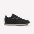 A side profile view of the Reebok Men’s Classic Leather Ripple Shoes in Black/Elevatedbeige/Black, featuring a beige EVA midsole and zigzag tread, displayed against a plain white background.