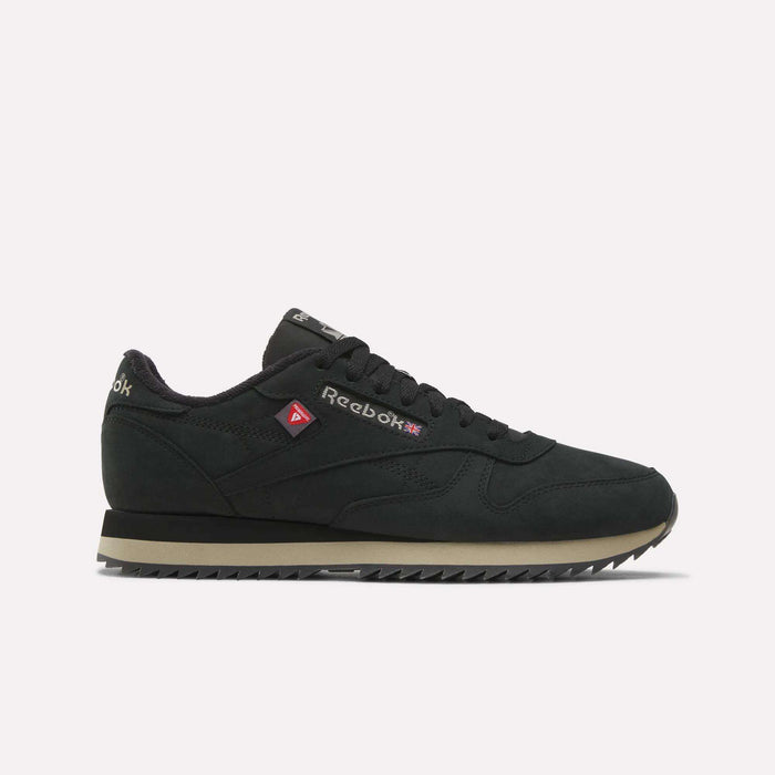 A side profile view of the Reebok Men’s Classic Leather Ripple Shoes in Black/Elevatedbeige/Black, featuring a beige EVA midsole and zigzag tread, displayed against a plain white background.