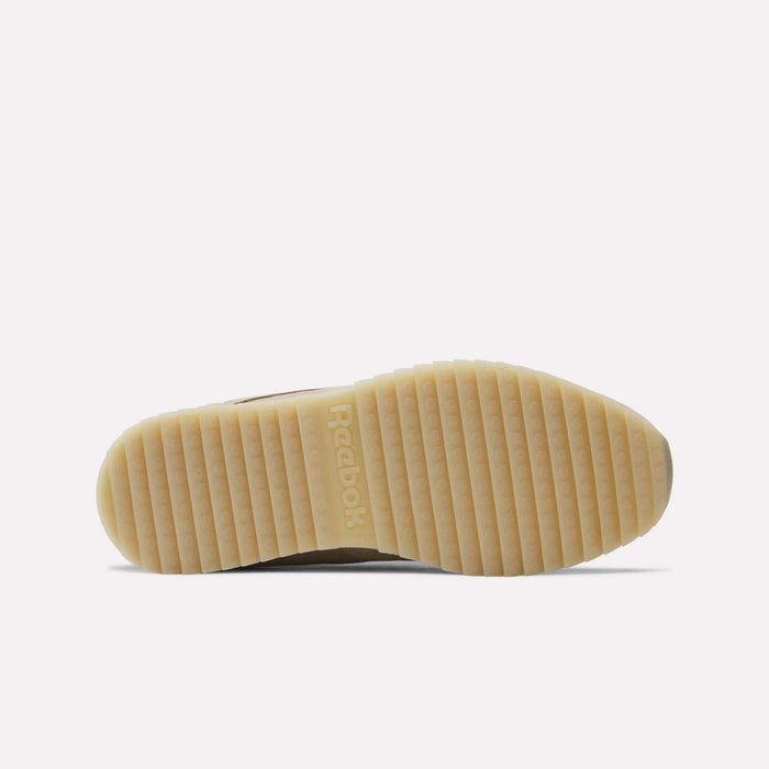 The image displays the sole of the Men’s Classic Leather Ripple Shoes by Reebok in beige, featuring a ribbed and grooved pattern with the Reebok logo embossed at the center.
