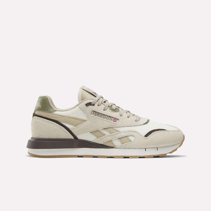 The Reebok Men's Classic Nylon 89 Shoes in Linen/Chalk/Elevated Beige feature retro '80s style, textured sole, EVA midsole, and side Reebok logo. Shown from the side on a white background with light brown accents.