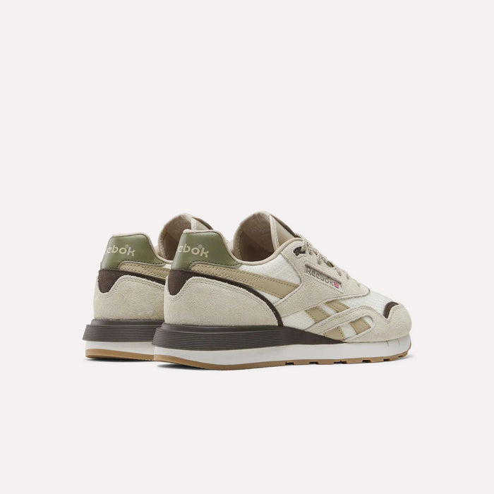 The Reebok Men's Classic Nylon 89 Shoes feature a beige suede upper with olive green and brown accents, shown from the back and side on a white background, evoking vintage '80s style.
