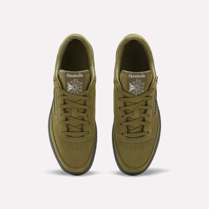 Top view of a pair of Reebok Men’s Club C 85 Shoes in olive green, featuring matching laces, white Reebok logos on the tongues, and black outsoles, displayed against a plain white background.